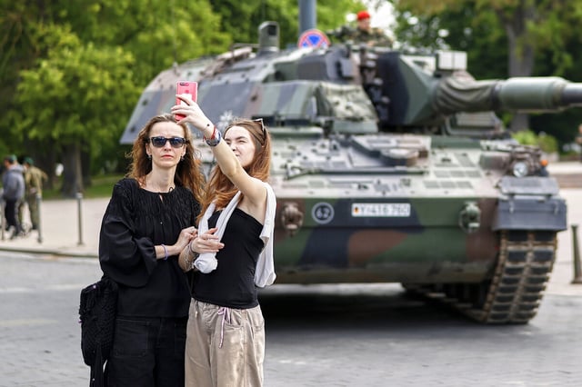 Two women in Vilnius, Lithuania, take a selfie near a German tank before the formal inauguration of a German brigade for NATO's eastern flank, May 22.