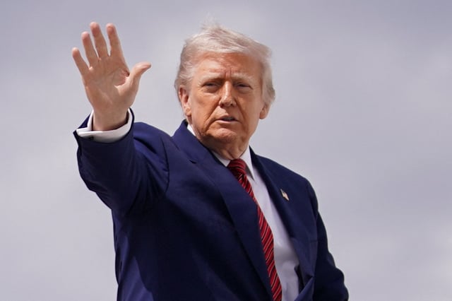 U.S. President Donald Trump boards Air Force One as he departs for New Jersey, at Joint Base Andrews, Maryland, U.S., May 23, 2025. REUTERS/Nathan Howard