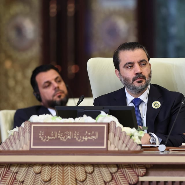 Syrian Foreign Minister Asaad al-Shibani attends the 34th Arab League summit, in Baghdad, Iraq, Saturday, May 17, 2025. (Thaier Al-Sudani/Pool via AP)