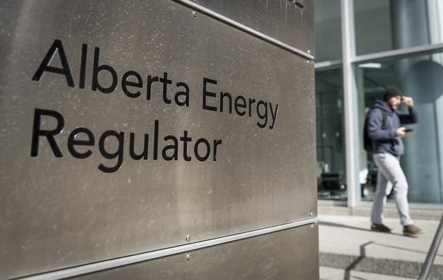 A person walks past the offices of the Alberta Energy Regulator in Calgary, Thursday, March 20, 2025.THE CANADIAN PRESS/Jeff McIntosh