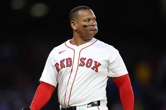 BOSTON, MASSACHUSETTS - MAY 21: Rafael Devers #11 of the Boston Red Sox reacts during the third inning against the New York Mets at Fenway Park on May 21, 2025 in Boston, Massachusetts.
