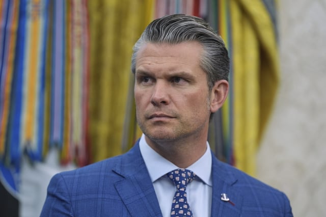Defense Secretary Pete Hegseth listens during an event with President Donald Trump to sign executive orders regarding nuclear energy in the Oval Office of the White House, Friday, May 23, 2025, in Washington. (AP Photo/Evan Vucci)