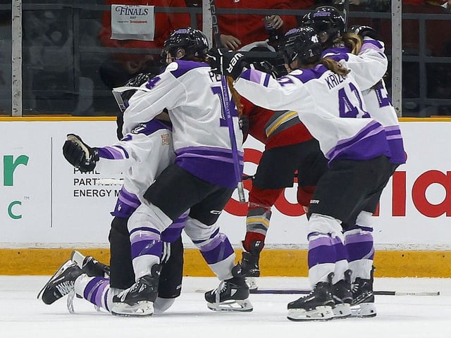  Britta Curl-Salemme, far left, celebrates with Frost teammates after scoring the winning goal against the Charge in overtime of Game 2 on Thursday night.