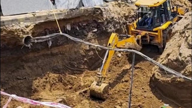 Rescue personnel at the site where soil collapsed on four workers at Old Faridabad Railway Station. (PTI)