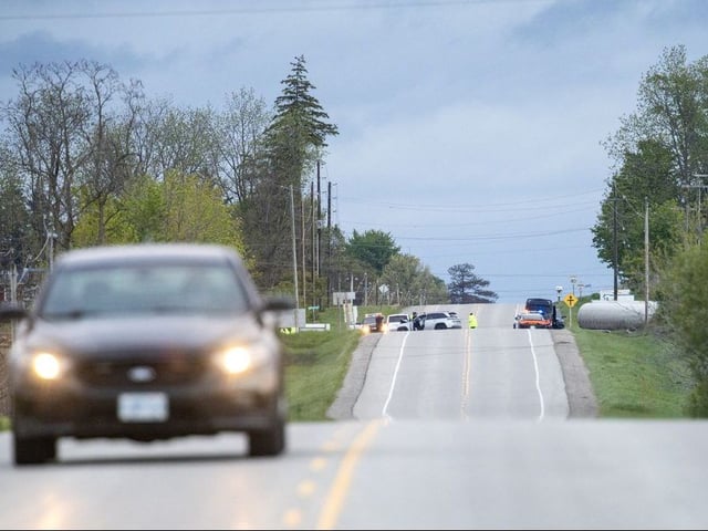 An OPP cruiser is parked near the intersection of Thorndale and Cobble Hill roads in Thames Centre as police investigate a crash that killed "several people" on Friday, May 23, 2025. (Derek Ruttan/The London Free Press)
