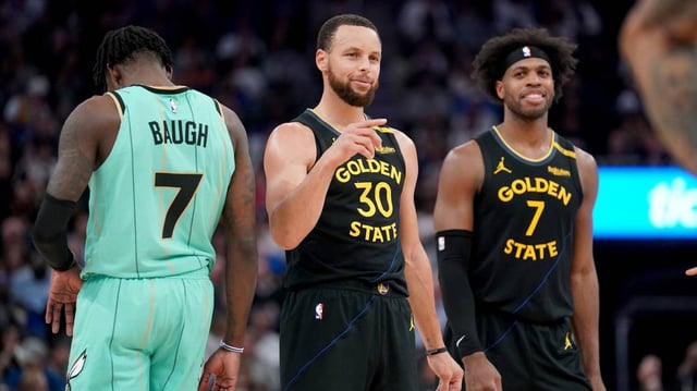 Feb 25, 2025; San Francisco, California, USA; Golden State Warriors guard Stephen Curry (30) and Buddy Hield (7) during a break in the third quarter against the Charlotte Hornets at the Chase Center. Mandatory Credit: Cary Edmondson-Imagn Images