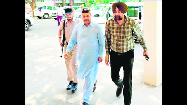 AAP MLA Raman Arora (centre) in VB custody on Friday. (HT Photo)