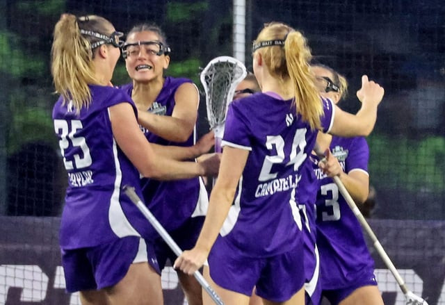 Northwestern’s Sam Smith, second from left, celebrates her game-winning goal with teammates against Boston College in the NCAA women’s lacrosse Final Four on May 23, 2025, in Foxborough, Mass. The Wildcats won 12-11 and will face top-seeded North Carolina in the final on Sunday. (Stuart Cahill/Boston Herald)