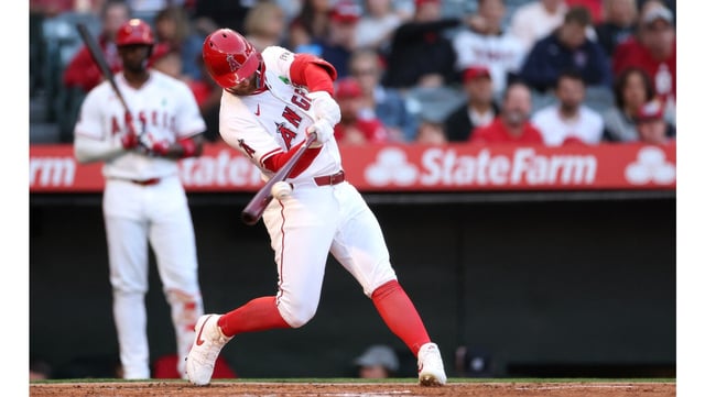 The Angels’ Taylor Ward hits a solo home run during the second inning of their game against the Miami Marlins on Friday night at Angel Stadium. (Photo by Luke Hales/Getty Images)
