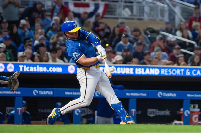 May 23, 2025; Minneapolis, Minnesota, USA; Minnesota Twins first base Ty France (13) hits a walk off home run against the Kansas City Royals in the ninth inning at Target Field. Mandatory Credit: Brad Rempel-Imagn Images