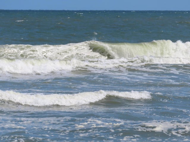 The ocean horizon is clear on Thursday, April 25, 2024, in Long Beach Township, N.J. Eight Jersey Shore towns, including Long Beach, are trying to convince New Jersey utility regulators that wind turbines planned for less than 9 miles off the town’s coast will scare away visitors, costing the area jobs and economic development. The wind power industry rejects those claims, and says turbines can coexist with tourism and fishing. (AP Photo/Wayne Parry)