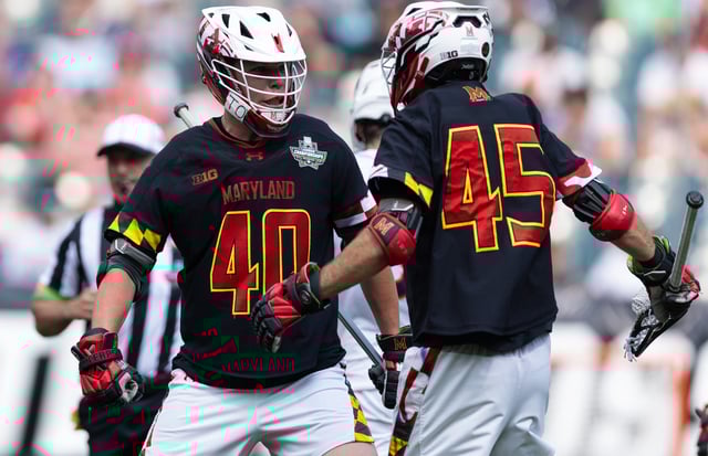Maryland defender Colin Burlace (40) and attack Daniel Kelly (45) celebrates a goal against Virginia during the semifinals of the 2024 NCAA men's lacrosse tournament at Lincoln Financial.