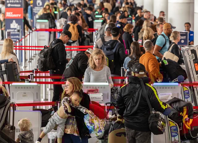 LOS ANGELES, CA - MAY 23: Travelers get boarding passes and check in baggage at the Delta Airlines terminal at Los Angeles International Airport on Thursday, May 23, 2024. Airport officials are urging people to plan ahead and give themselves plenty of time to reach the airport and board their flights. Memorial Day traditionally marks the beginning of the summer travel season and airport officials said passenger numbers and vehicular traffic will be rising over the next few days and remain high for the next few months. (Myung J. Chun / Los Angeles Times via Getty Images)