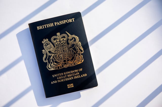 A copy of the British National (Overseas) passport arranged in Hong Kong, China, on Saturday, Jan. 30, 2021. Prime Minister Boris Johnson estimates about 300,000 Hong Kong citizens will take advantage of a new visa route to leave the former British colony and settle in the U.K., despite nearly three million people being eligible. Photographer: Paul Yeung/Bloomberg via Getty Images