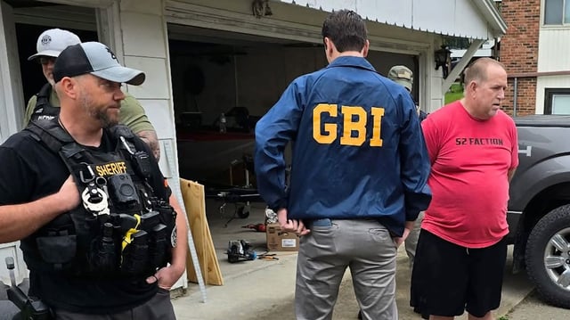 Jon Worrell is seen being arrested by the GBI in Maryville, Missouri.