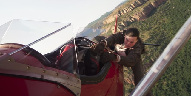 Ethan Hunt (Tom Cruise) goes to extremes to save the world, including hanging out of a plane, in the action thriller "Mission: Impossible – The Final Reckoning."