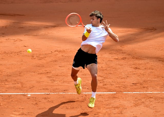 Tennis - Hamburg European Open - Am Rothenbaum, Hamburg, Germany - May 24, 2025 Italy's Flavio Cobolli in action during the final match against Russia's Andrey Rublev REUTERS/Fabian Bimmer