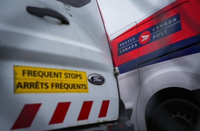 Canada Post says it has received strike notices from the union representing some 55,000 postal workers, with operations poised to shut down by end of week. Canada Post vehicles are seen parked at a delivery depot in Vancouver, B.C., Tuesday, Dec. 17, 2024.  THE CANADIAN PRESS/Darryl Dyck