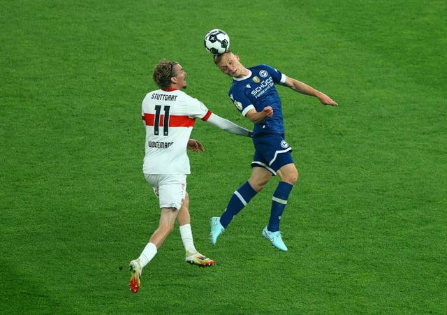 Soccer Football - DFB Cup - Final - Arminia Bielefeld v VFB Stuttgart - Olympiastadion, Berlin, Germany - May 24, 2025 VfB Stuttgart's Nick Woltemade in action with Arminia Bielefeld's Leon Schneider REUTERS/Fabrizio Bensch