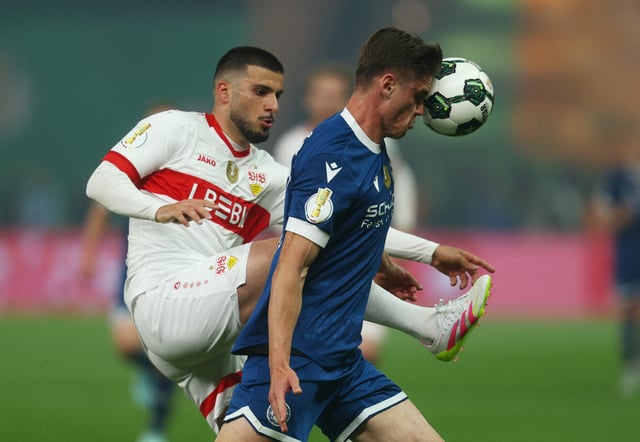 Soccer Football - DFB Cup - Final - Arminia Bielefeld v VFB Stuttgart - Olympiastadion, Berlin, Germany - May 24, 2025 Arminia Bielefeld's Maximilian Grosser in action with VfB Stuttgart's Deniz Undav REUTERS/Leon Kuegeler