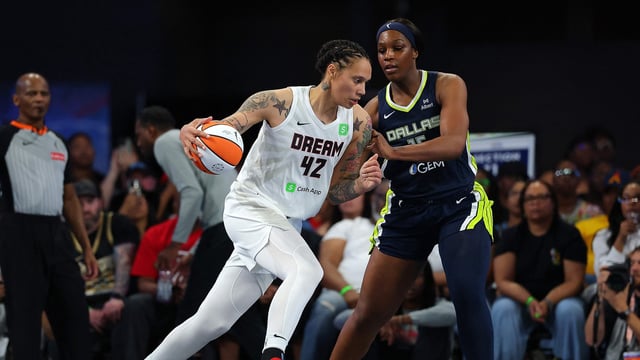 Brittney Griner #42 of the Atlanta Dream drives against Teaira McCowan #15 of the Dallas Wings during the fourth quarter at Gateway Center Arena on May 24, 2025 in College Park, Georgia. (Photo by Kevin C. Cox / GETTY IMAGES NORTH AMERICA / Getty Images via AFP)