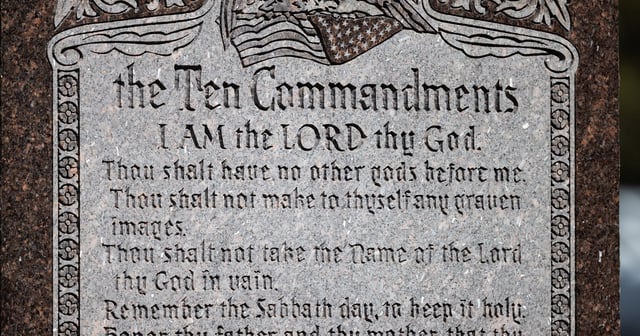 The Ten Commandments, written out on a monument, sit outside the Texas Capitol on March 17, 2025.