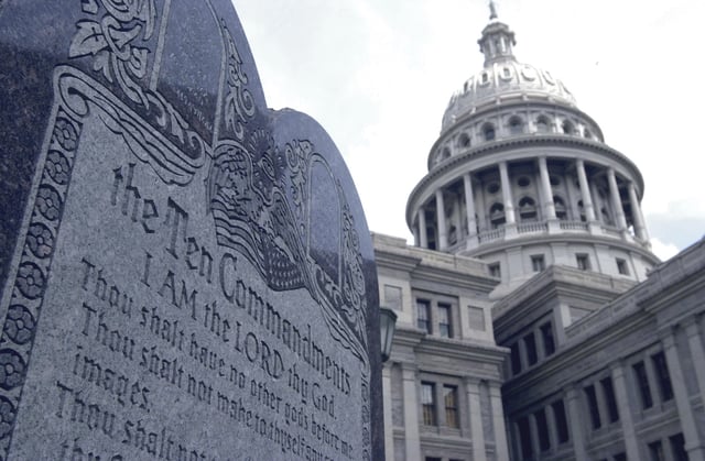 FILE - This 5-foot tall stone slab bearing the Ten Commandments stands near the Capitol in Austin, Texas, in this July 29, 2002 file photo. (AP Photo/Harry Cabluck, File)
