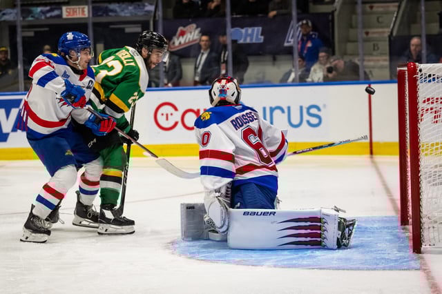 PHOTO COURTESY VINCENT ETHIER/CHL London Knights forward Sam O'Reilly tips a puck past Moncton Wildcats net minder Mathis Rousseau to win the second game of the 2025 Memorial Cup, 3-2 in overtime on Saturday.