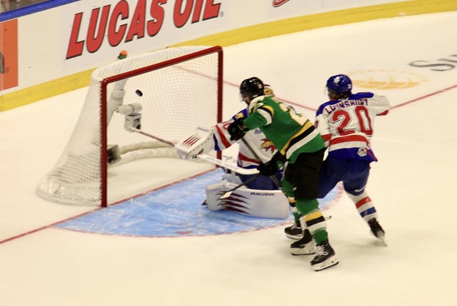 Rimouski, QC - Sam O'Reilly deflects in the game winning goal in overtime on Day 2 of the 2025 Memorial Cup tournament to give the London Knights a 3-2 win over the Moncton Wildcats.