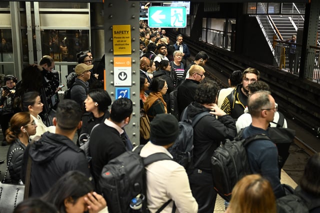 Passengers wait on Platform 2 at Town Hall Station as a power outage causes peak hour chaos, Sydney, Tuesday, May 20, 2025. (AAP Image/Dean Lewins) NO ARCHIVING