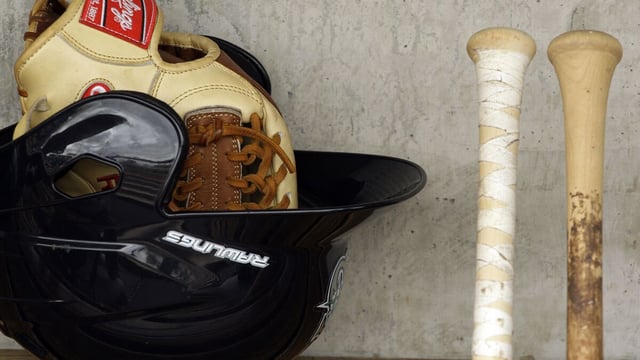 Seattle Mariners baseball equipment in the dugout before the start of a spring training baseball game against the Milwaukee Brewers Monday, March 8, 2010, in Phoenix. The Brewers defeated the Mariners 6-2. (AP Photo/Ross D. Franklin)