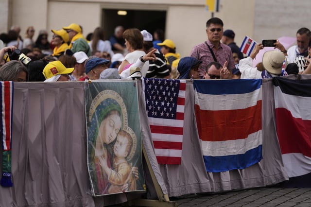 Faithful wait for Pope Leo XIV weekly general audience in St. Peter's Square at The Vatican, Wednesday, May 21, 2025. (AP Photo/Gregorio Borgia)