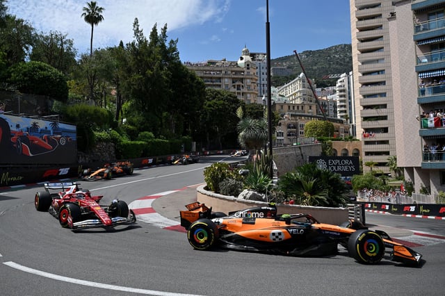 Lando Norris leads Charles Leclerc into the Fairmont Hairpin during the Monaco Grand Prix.