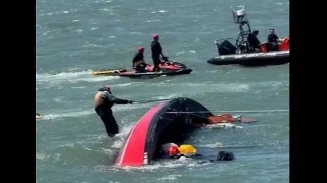 Another boat tried to tow the sailboat, which flipped onto its side, the Coast Guard said.