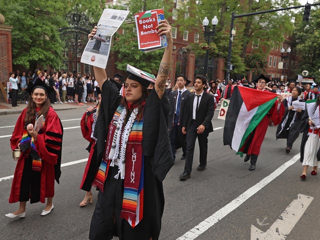 Cambridge, MA - May 23: Graduates and protestors blocked off Massachusetts Ave. in Harvard Square during a demonstration. (Photo by David L. Ryan/The Boston Globe via Getty Images)
