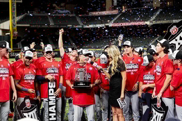 Arizona coach Chip Hale accepts the championship trophy as the Wildcats celebrate their 2-1 victory over TCU in the Big 12 Baseball Championship title game on May 24, 2025, at Globe Life Field in Arlington, Texas.