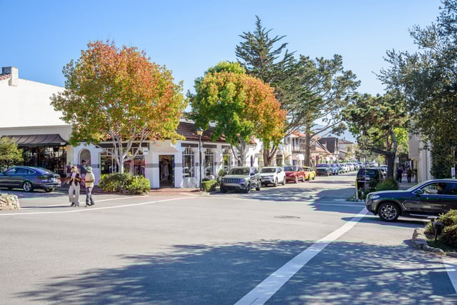 Carmel-By-The-Sea, CA - October 18, 2022: View of Ocean avenue on a clear afternoon. Ocean Avenue, downtown Carmel&#39;s main street, is lined with many shops, coffee houses, and galleries.