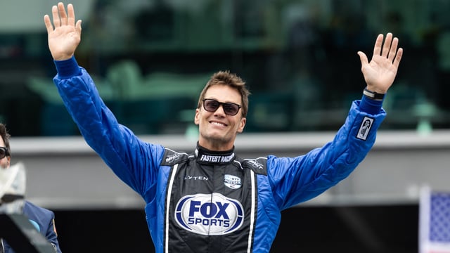 Tom Brady waves to the booing crowd prior to the IndyCar Series 109th Running of the Indianapolis 500 at Indianapolis Motor Speedway.