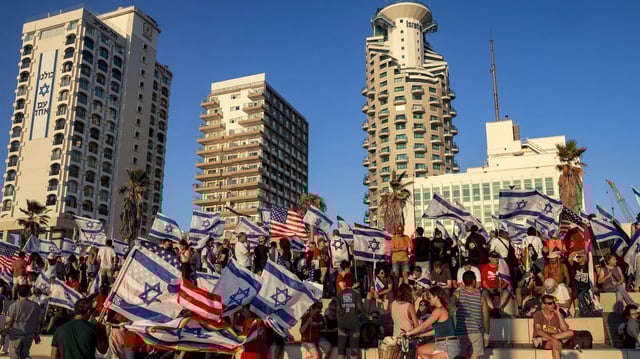 Demonstrators rally with Israeli and US flags during a protest against the Israeli government's judicial overhaul bill outside the US Embassy Tel Aviv branch office in Tel Aviv on July 11, 2023. Photo: Menahem Kahana /AFP via Getty Images