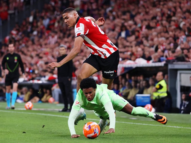Soccer Football - LaLiga - Athletic Bilbao v FC Barcelona - San Mames, Bilbao, Spain - May 25, 2025 FC Barcelona's Alejandro Balde in action with Athletic Bilbao's Maroan Sannadi REUTERS/Pankra Nieto