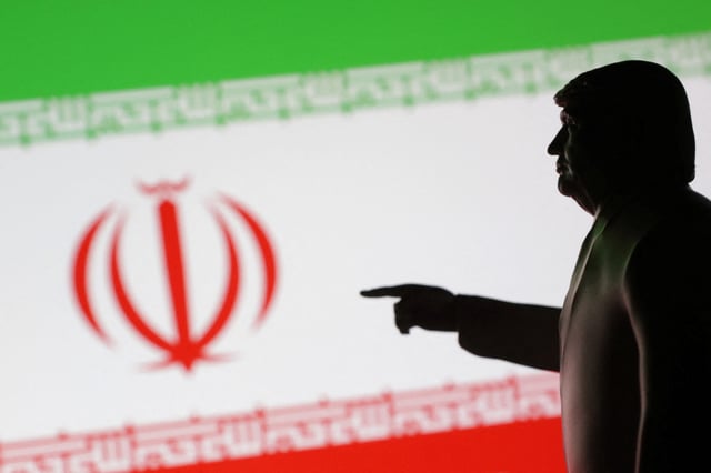 A 3D-printed miniature model depicting U.S. President Donald Trump and Iran flag in this illustration taken,  April 17, 2025. REUTERS/Dado Ruvic/Illustration/File Photo