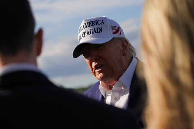 U.S. President Donald Trump speaks to the media before boarding Air Force One as he departs for Washington, D.C., at Morristown Municipal Airport in Morristown, New Jersey, U.S., May 25, 2025. REUTERS/Nathan Howard/File Photo