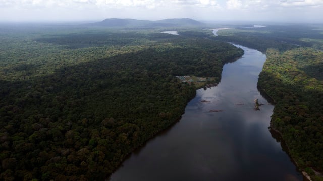 The Essequibo River flows through Kurupukari crossing in Guyana on November 19, 2023. Venezuela has long claimed Guyana's Essequibo region, a territory larger than Greece and rich in oil and minerals.