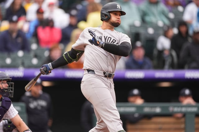 New York Yankees&#39; J.C. Escarra follows the flight of his RBI single off Colorado Rockies relief pitcher Tyler Kinley in the eighth inning of a baseball game Sunday, May 25, 2025, in Denver. (AP Photo/David Zalubowski)