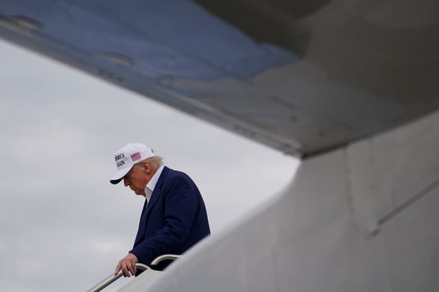 U.S. President Donald Trump disembarks Air Force One as he arrives at Joint Base Andrews, Maryland, U.S., May 25, 2025. REUTERS/Nathan Howard