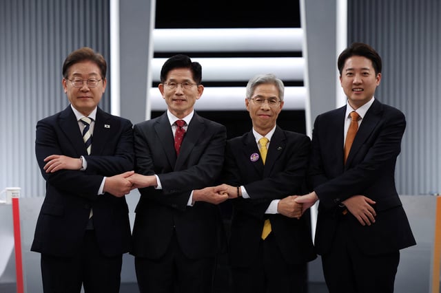 South Korea's presidential candidates, Kim Moon-soo of the People Power Party, Kwon Young-guk of the Democratic Labor Party, Lee Jun-seok of the New Reform Party and Lee Jae-myung of the Democratic Party pose for photograph ahead of the second televised debate for the upcoming presidential election in Seoul, South Korea, May 23, 2025.     REUTERS/Kim Hong-Ji/Pool/File Photo