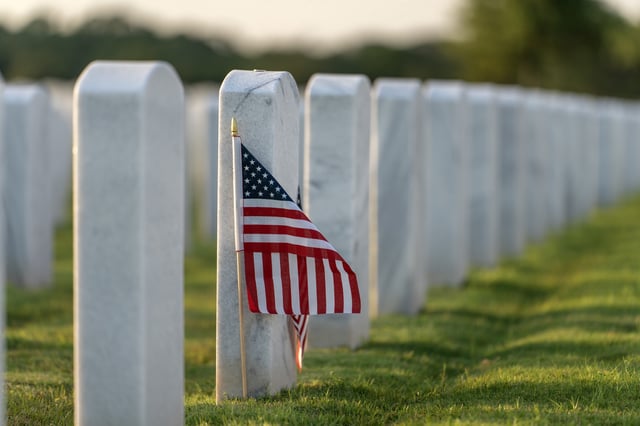 A stock image of white military headstones in Sarasota National Cemetery.