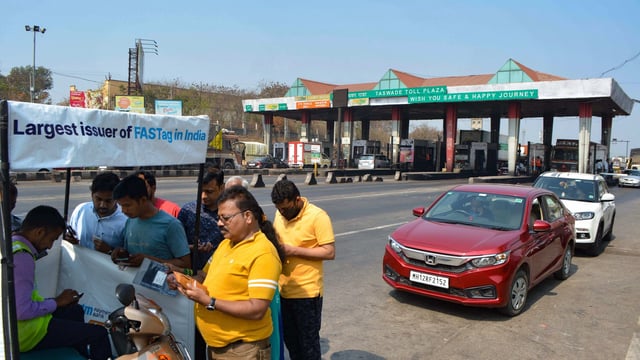 People register for FASTag at a Taswade toll plaza on the Pune-Bangalore national highway.
