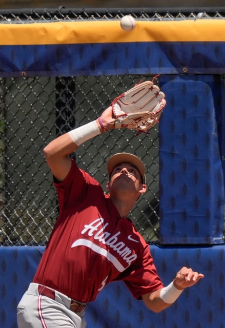 May 21, 2025; Hoover, AL, USA; Alabama right fielder Bryce Fowler (9) battles the sun to make the catch on a ball hit by a Tennessee batter in the second round of the SEC Baseball Tournament at the Hoover Met.