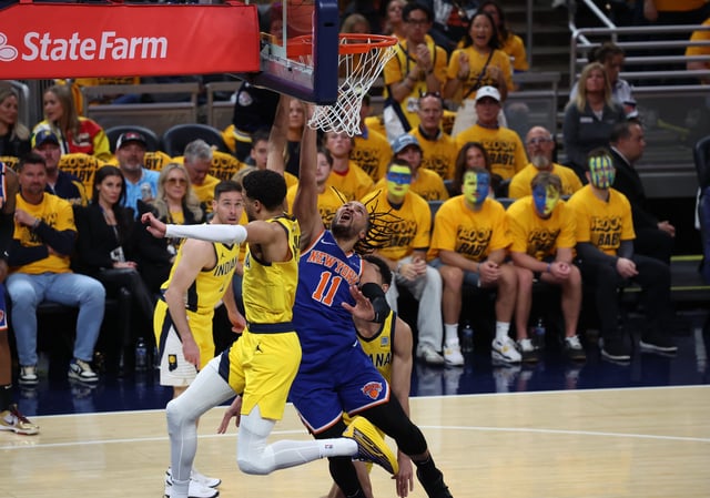 New York Knicks guard Jalen Brunson (11) shoots a layup in Game 3 against the Indiana Pacers.